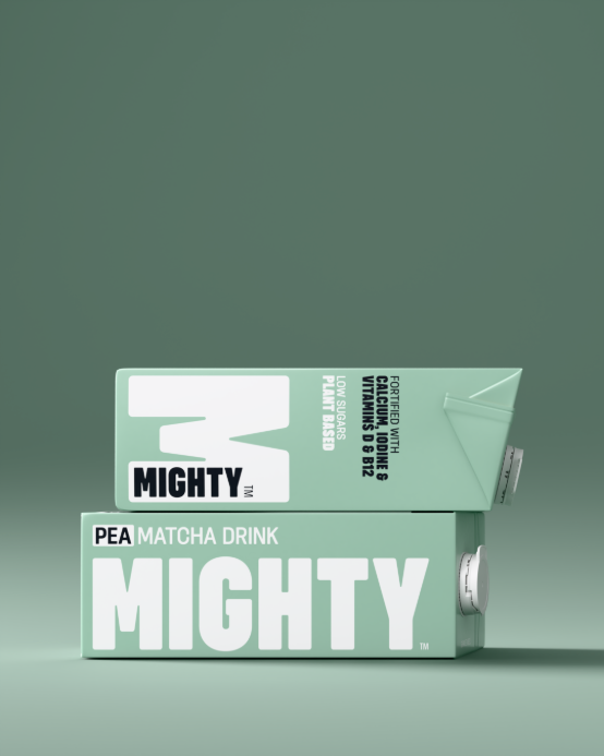Two MIGHTY Pea Matcha Drink cartons stacked on a sage green set