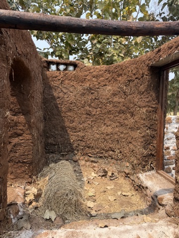 Mud wall detail with straw and stone